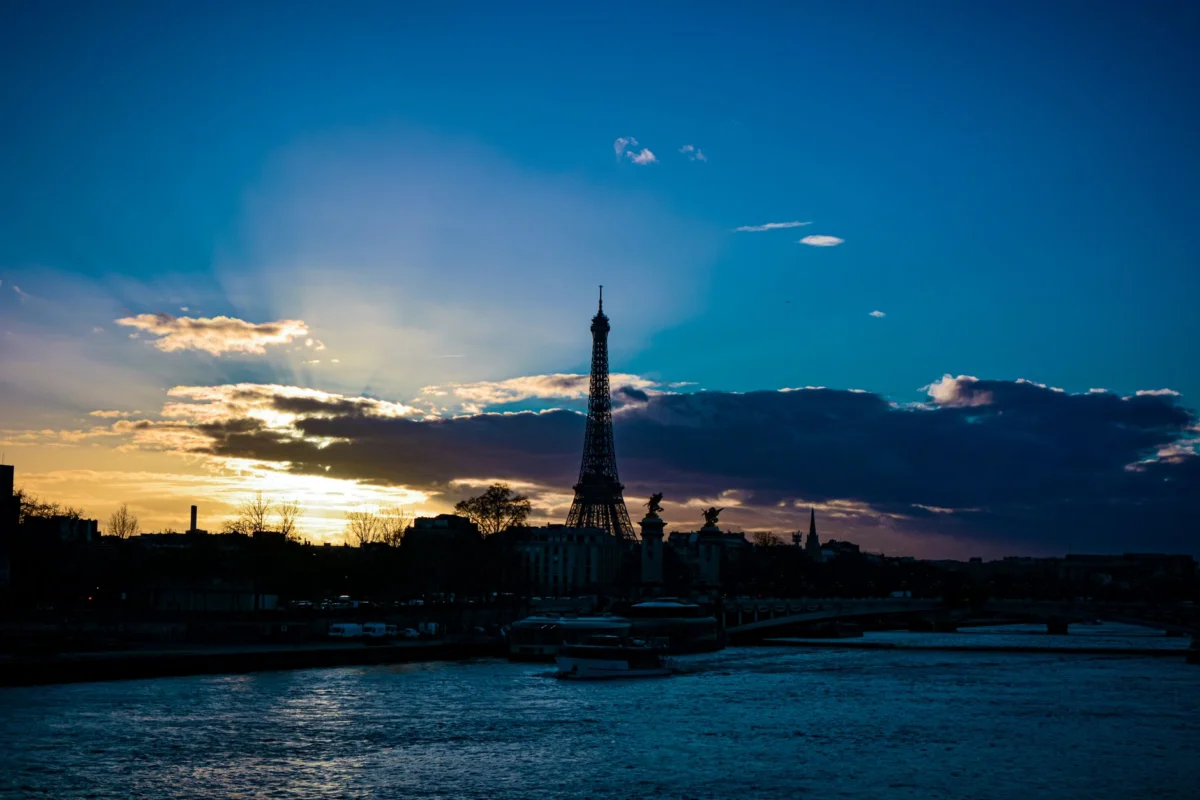 Eiffel Tower silhouette at sunset in Paris
