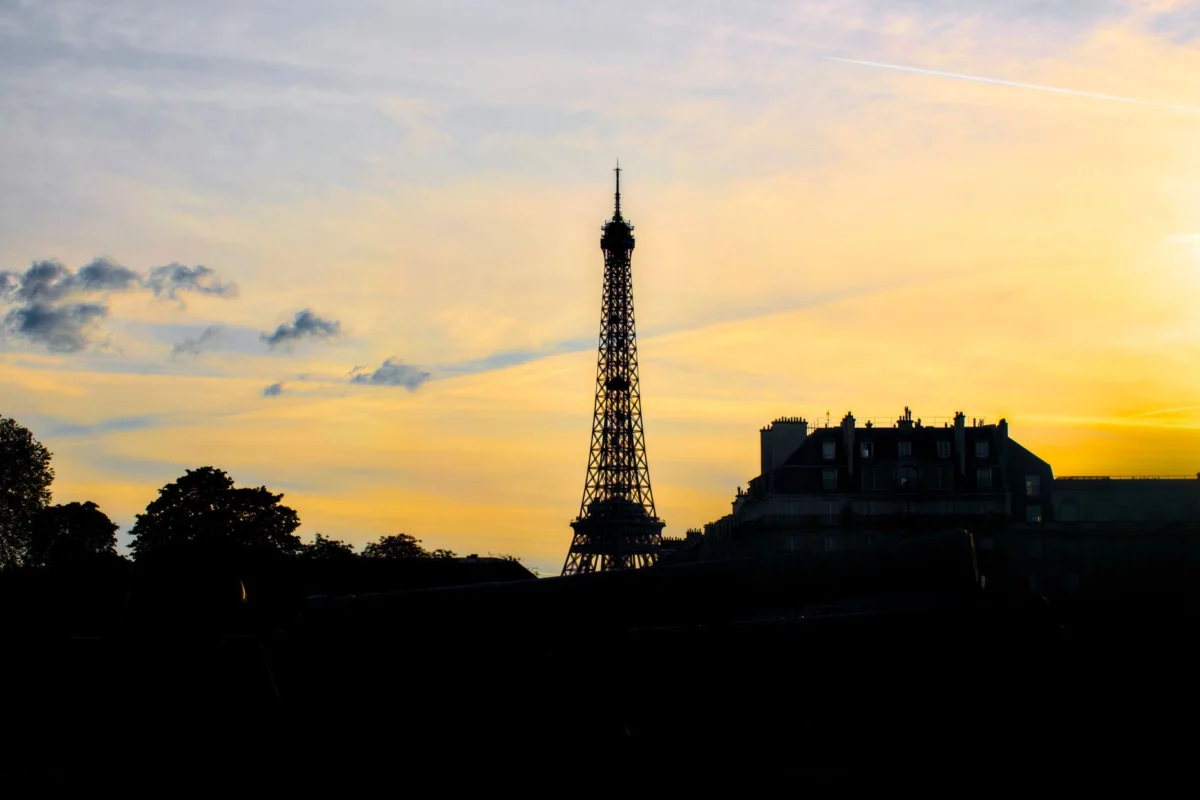 Eiffel Tower glowing at sunset in Paris