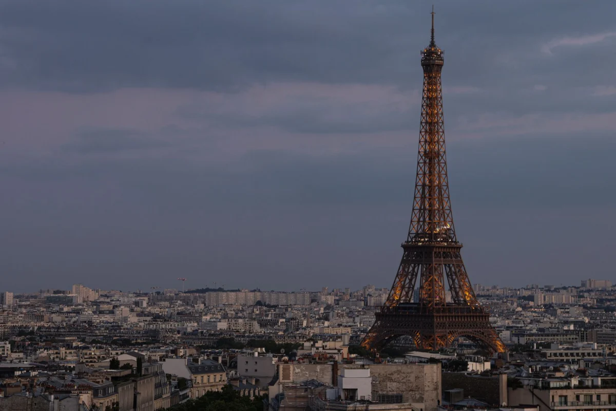 View of the Eiffel Tower at twilight from a rooftop in Paris
