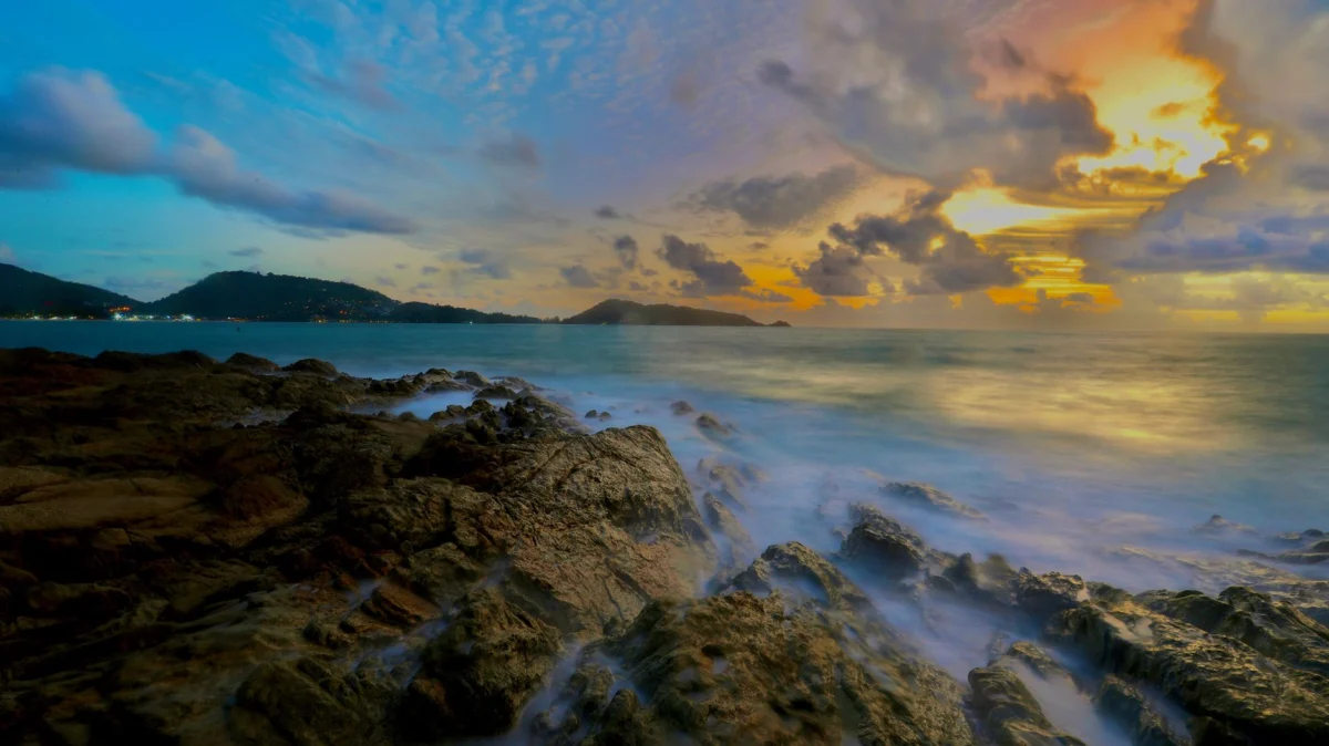Romantic sunset over a beachfront in Phuket, perfect for photography