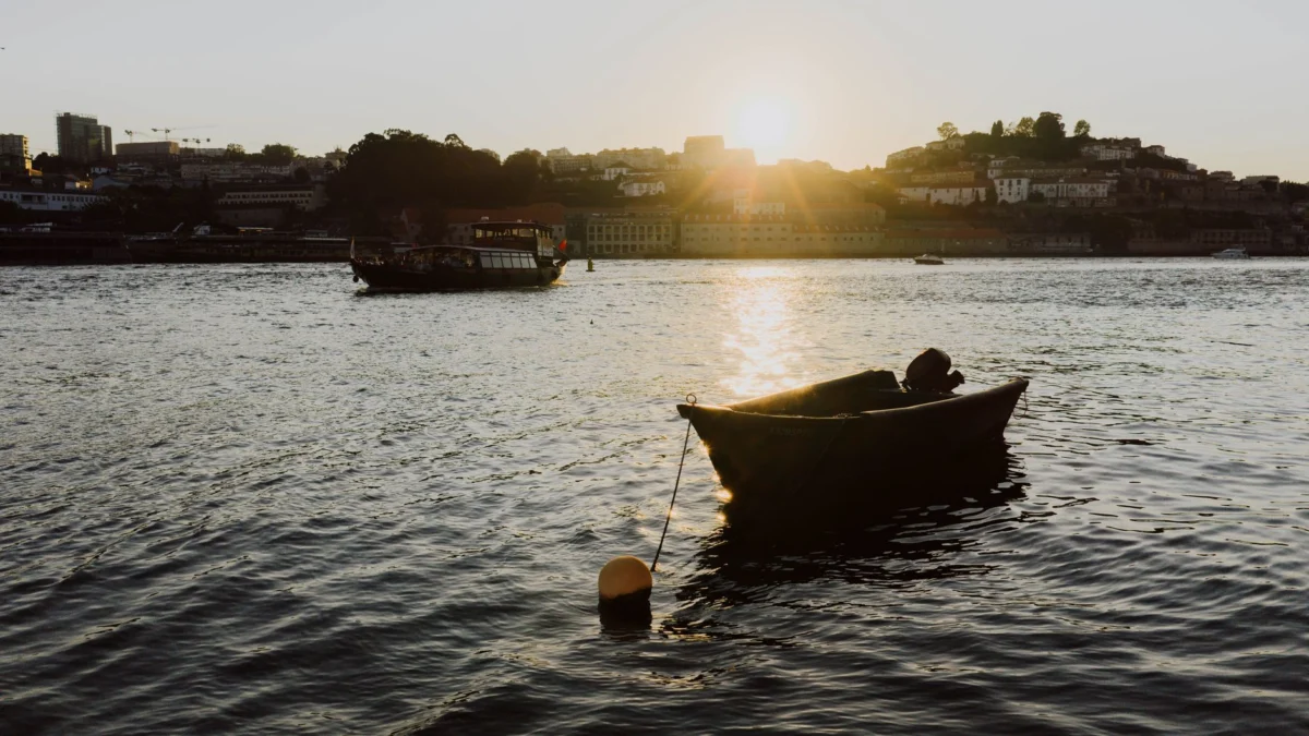 Scenic sunset over the Douro River in Porto with the city skyline