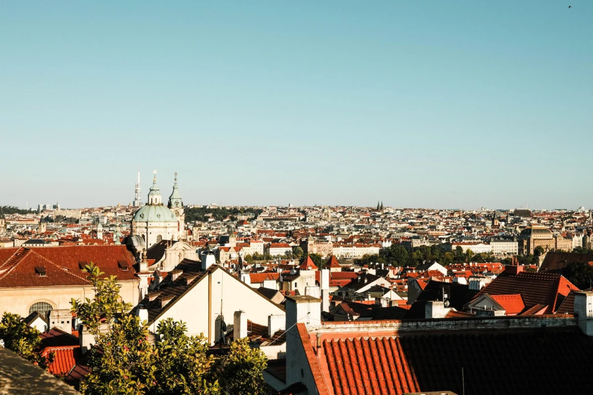Iconic Prague skyline with historic buildings and rooftops at sunset