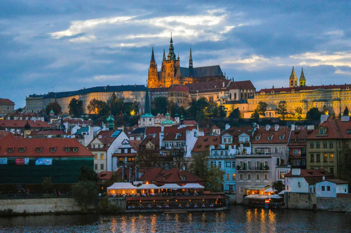 Prague Old Town skyline at sunset, view from a historic bridge