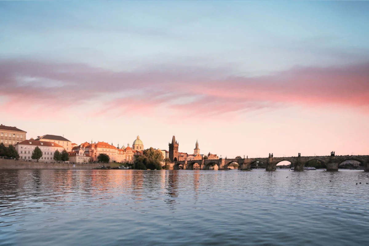 Romantic view of sunset over Prague's serene river