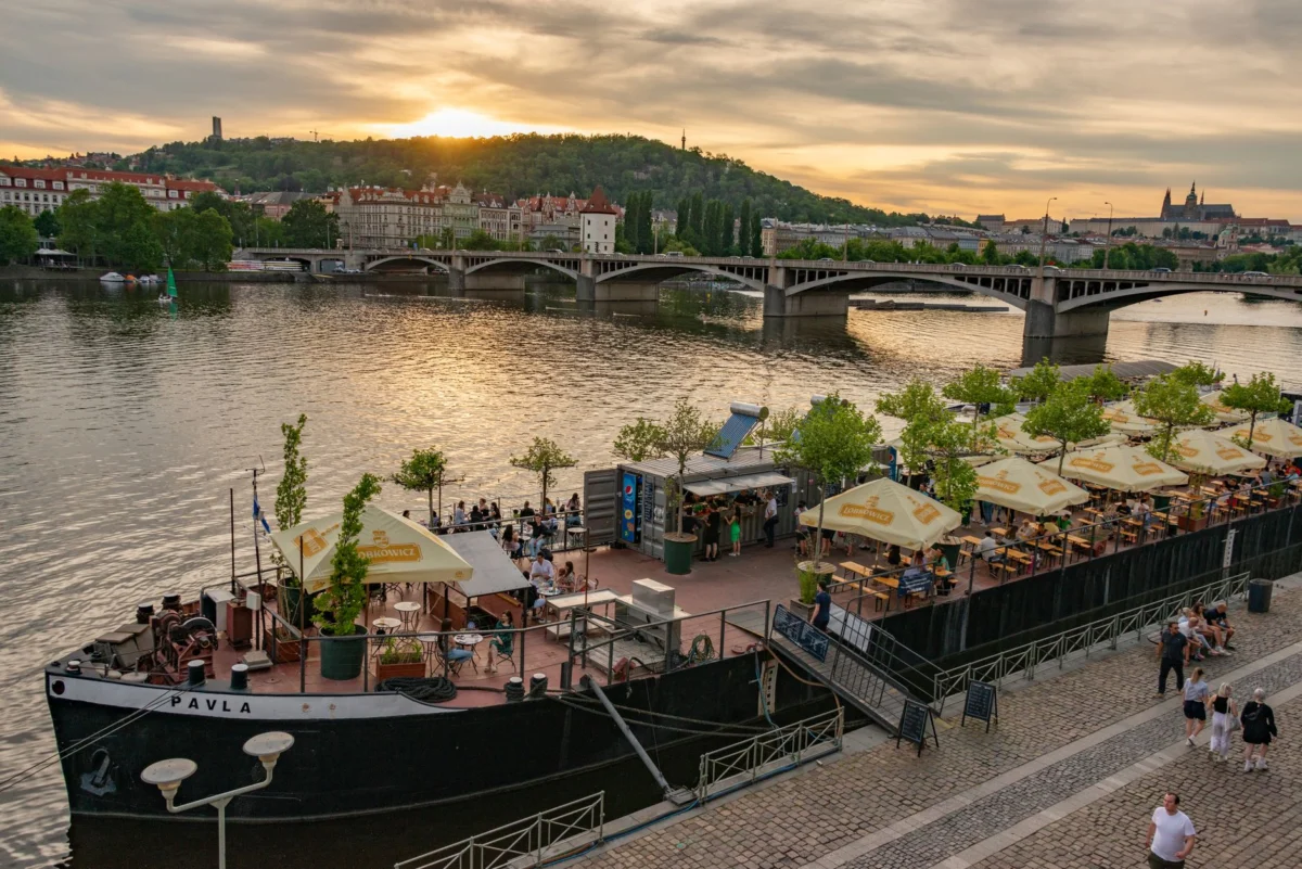 Scenic view of Prague riverside at sunset