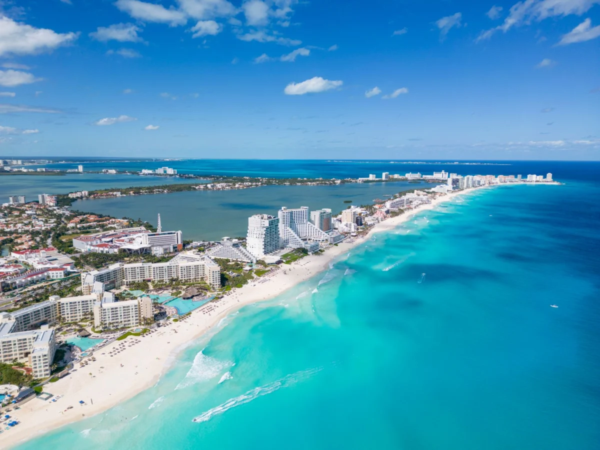 Romantic sunset over Cancun beach with luxury hotels