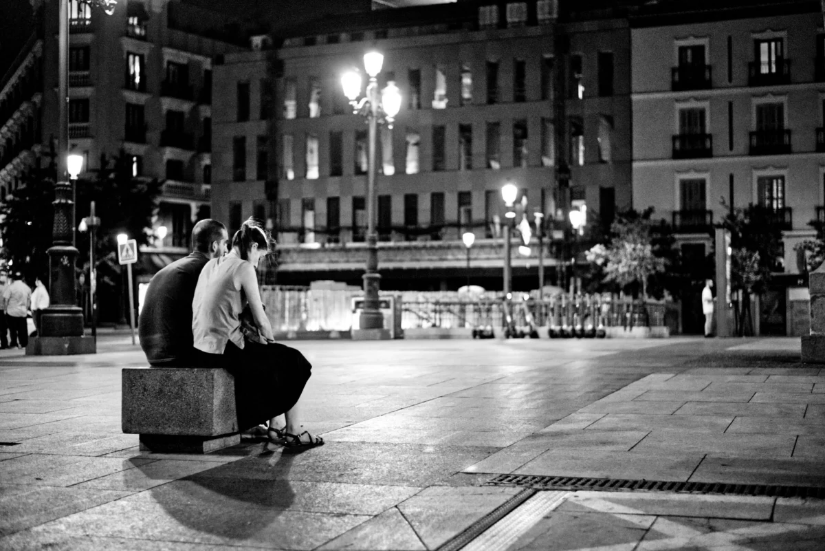 Couple enjoying a romantic view of Madrid's skyline at sunset