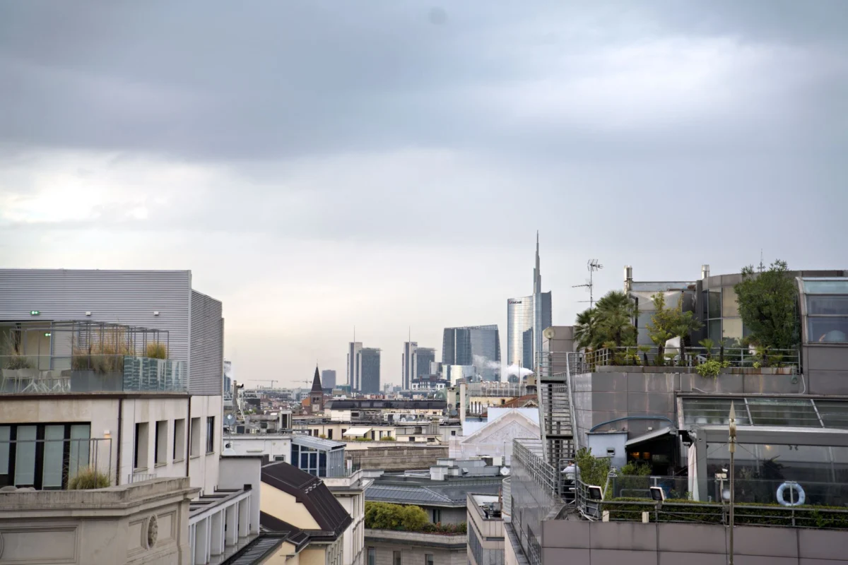 Romantic rooftop view over Milan skyline
