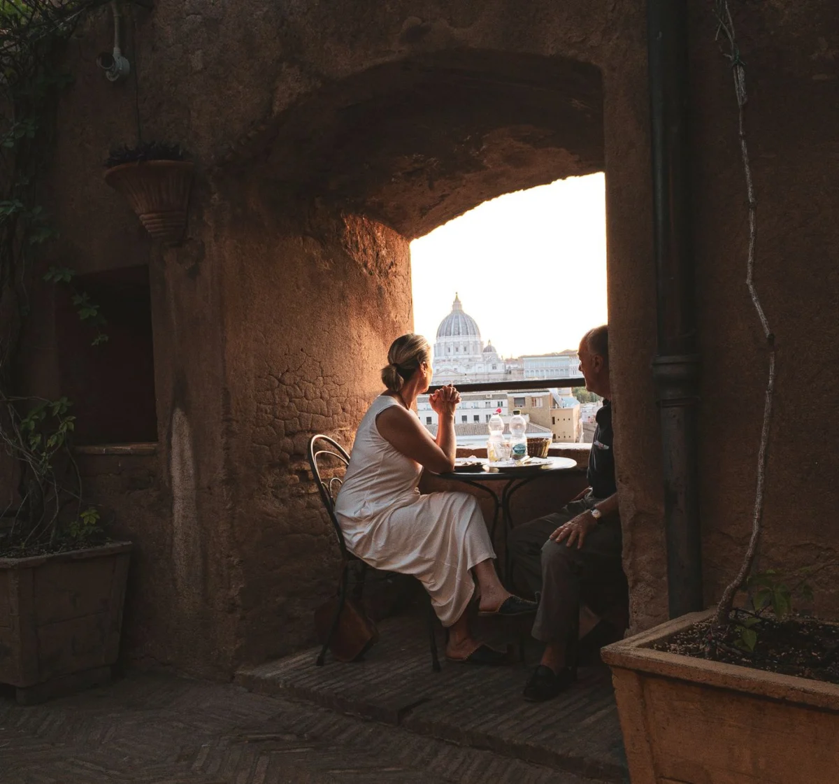 Romantic rooftop dinner with a view of Rome at sunset