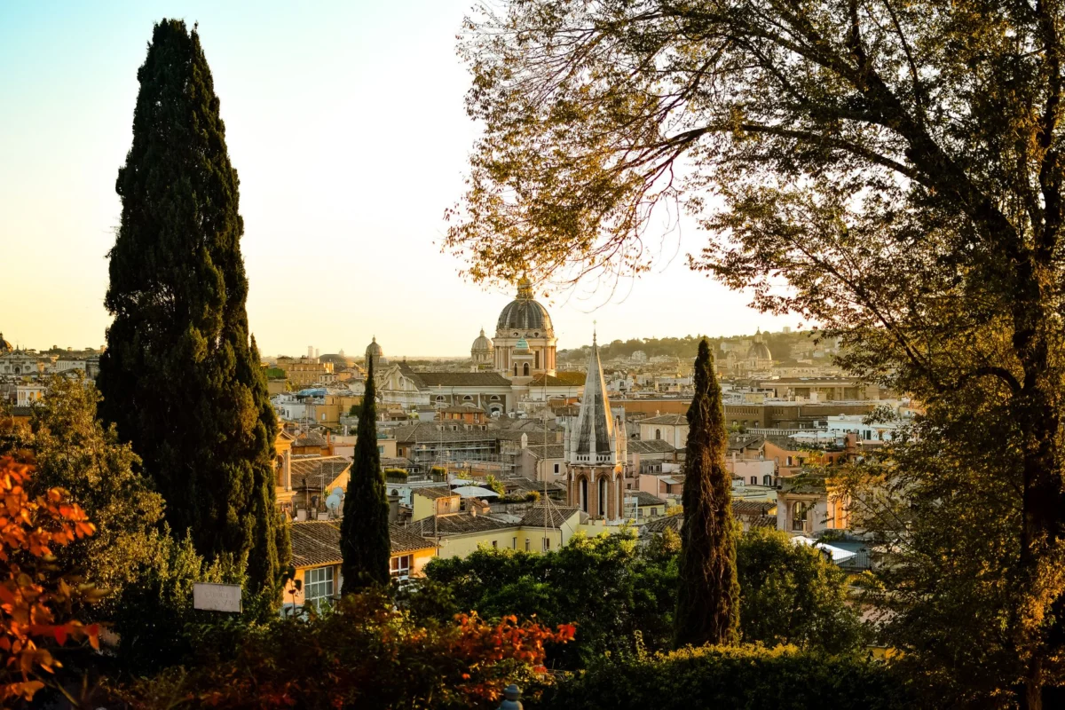 Beautiful view of Rome skyline at sunset, highlighting iconic landmarks