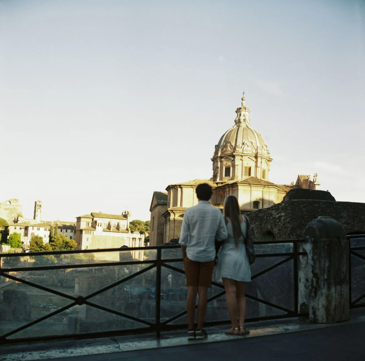 Couple overlooking Rome's stunning skyline at sunset