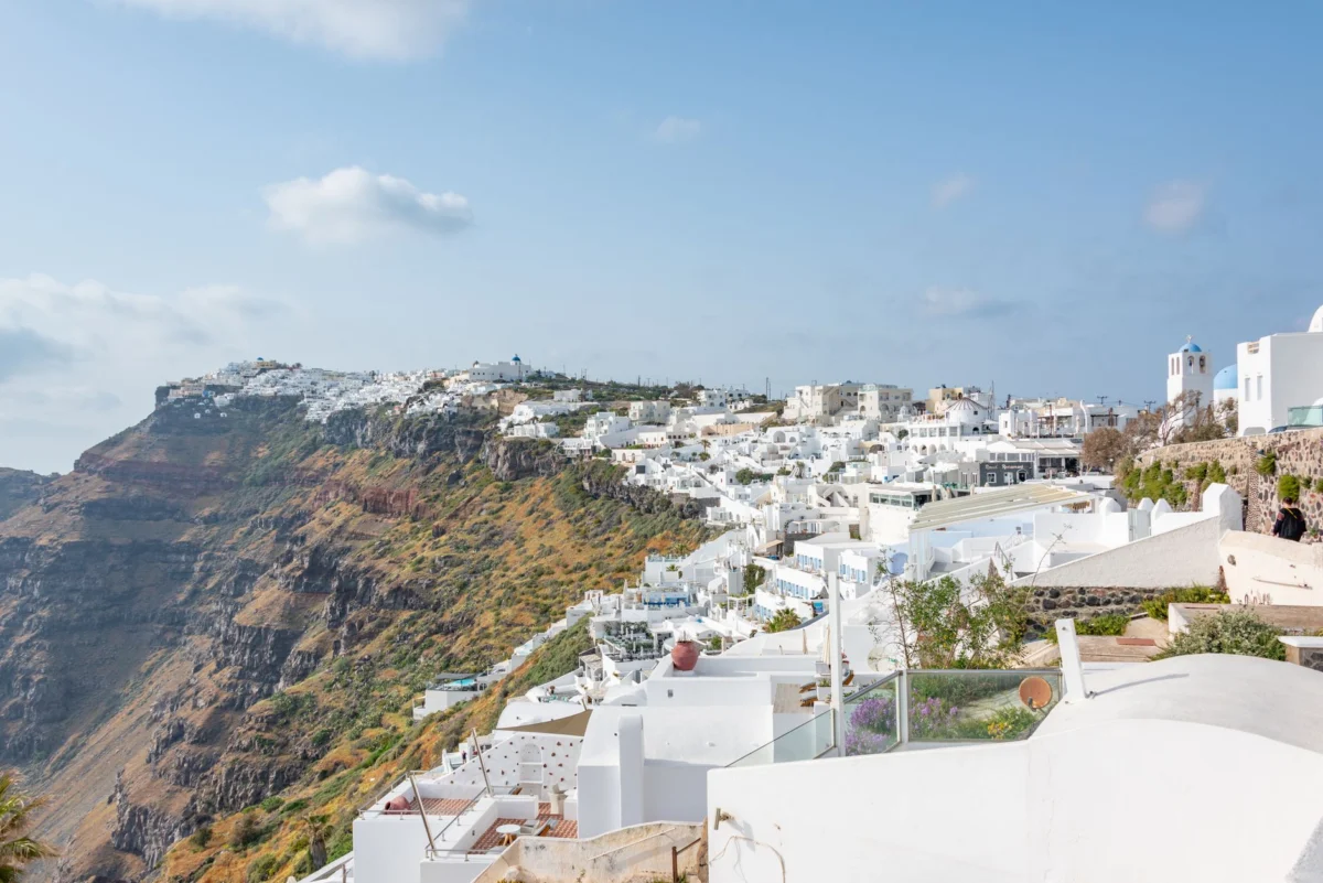 Stunning cliffside village view in Santorini at sunset