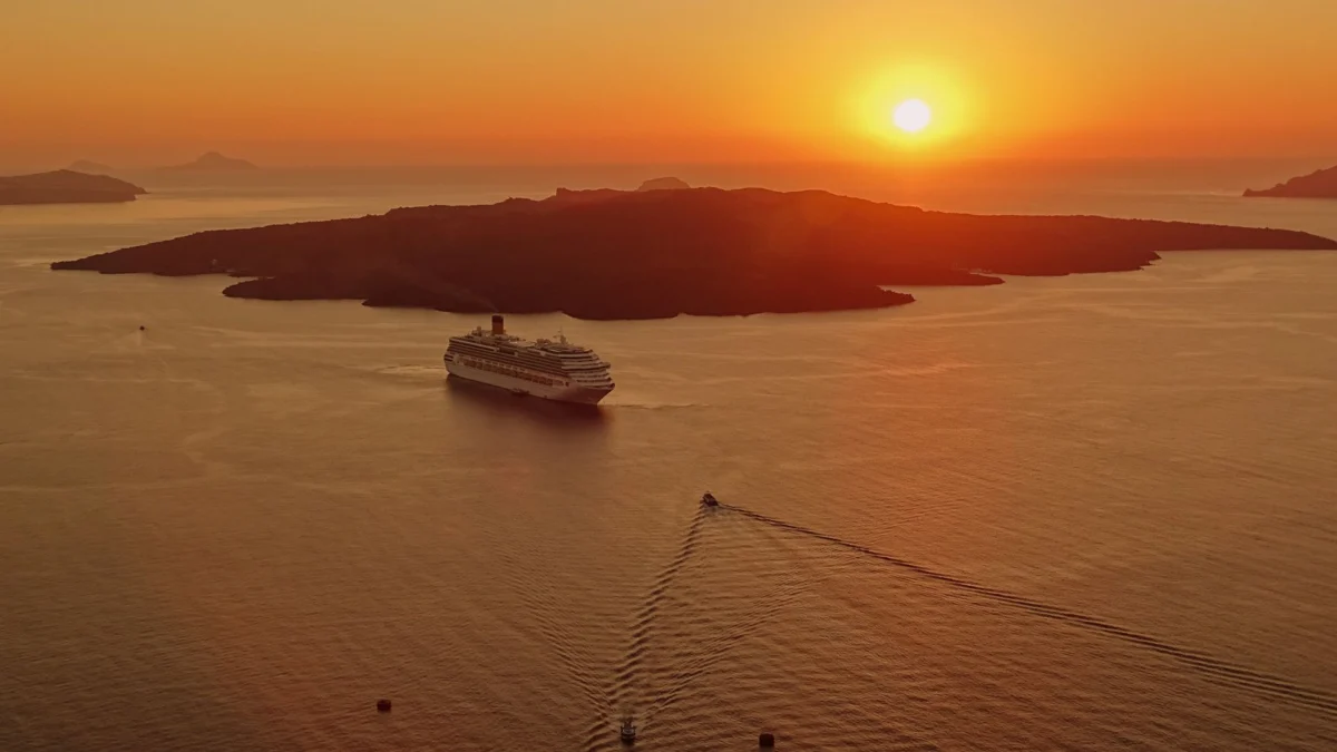 Couple enjoying a Santorini sunset view over the caldera