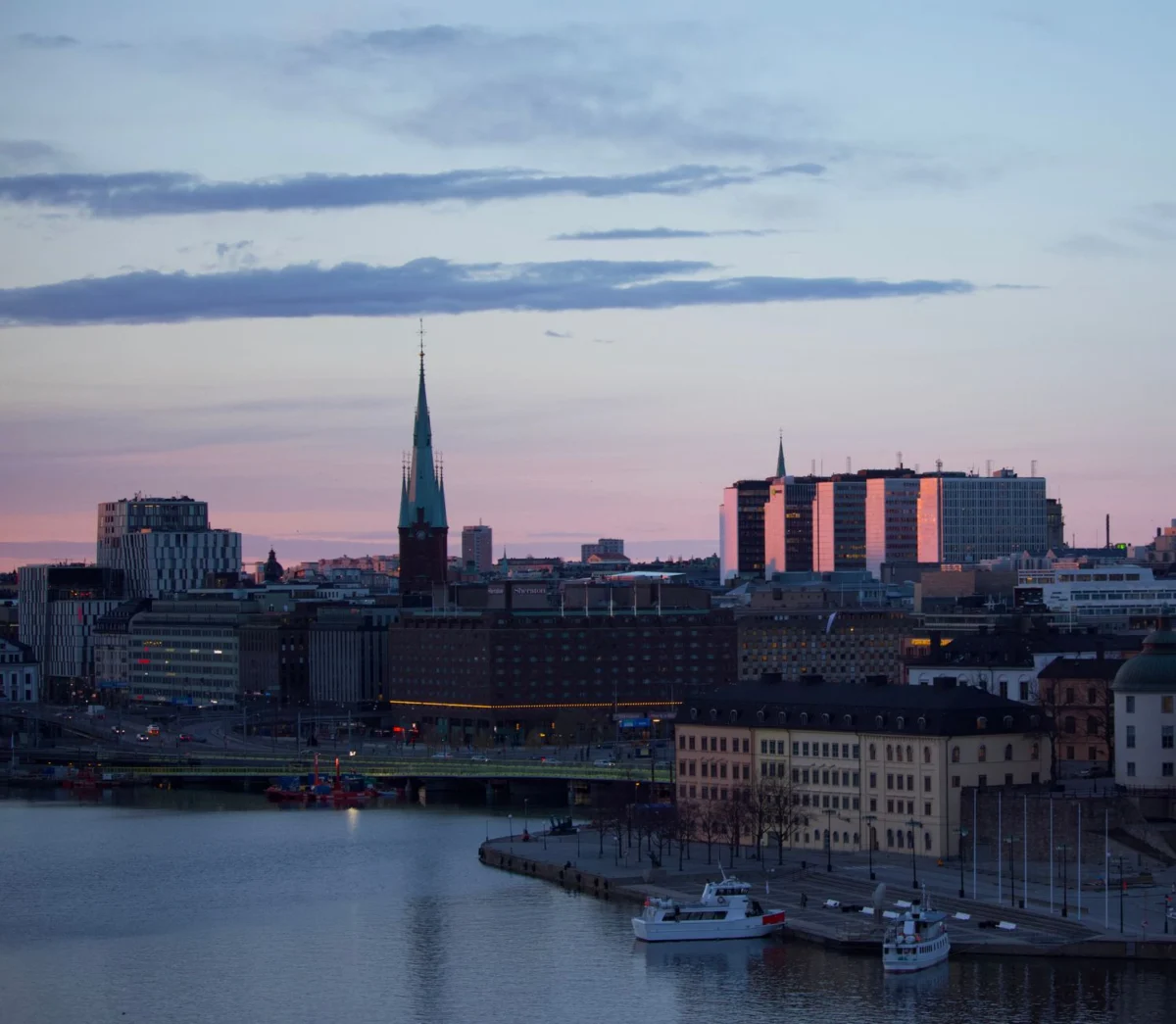 Scenic sunset over Stockholm's iconic skyline with cultural landmarks