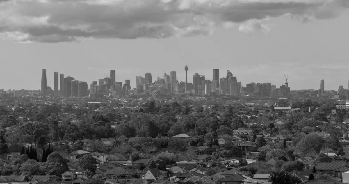 Panoramic view of Sydney skyline at dusk with iconic buildings