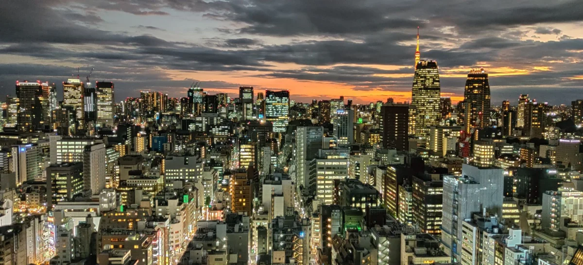 Dramatic sunset over Tokyo skyline showcasing iconic landmarks