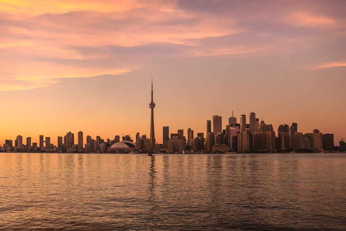 Toronto skyline at sunset showcasing cultural landmarks