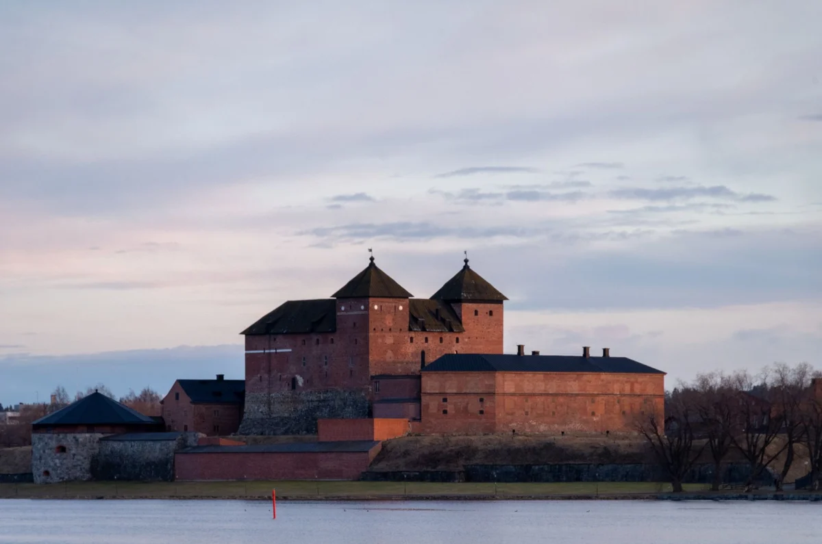 Historic Turku Castle illuminated at dusk