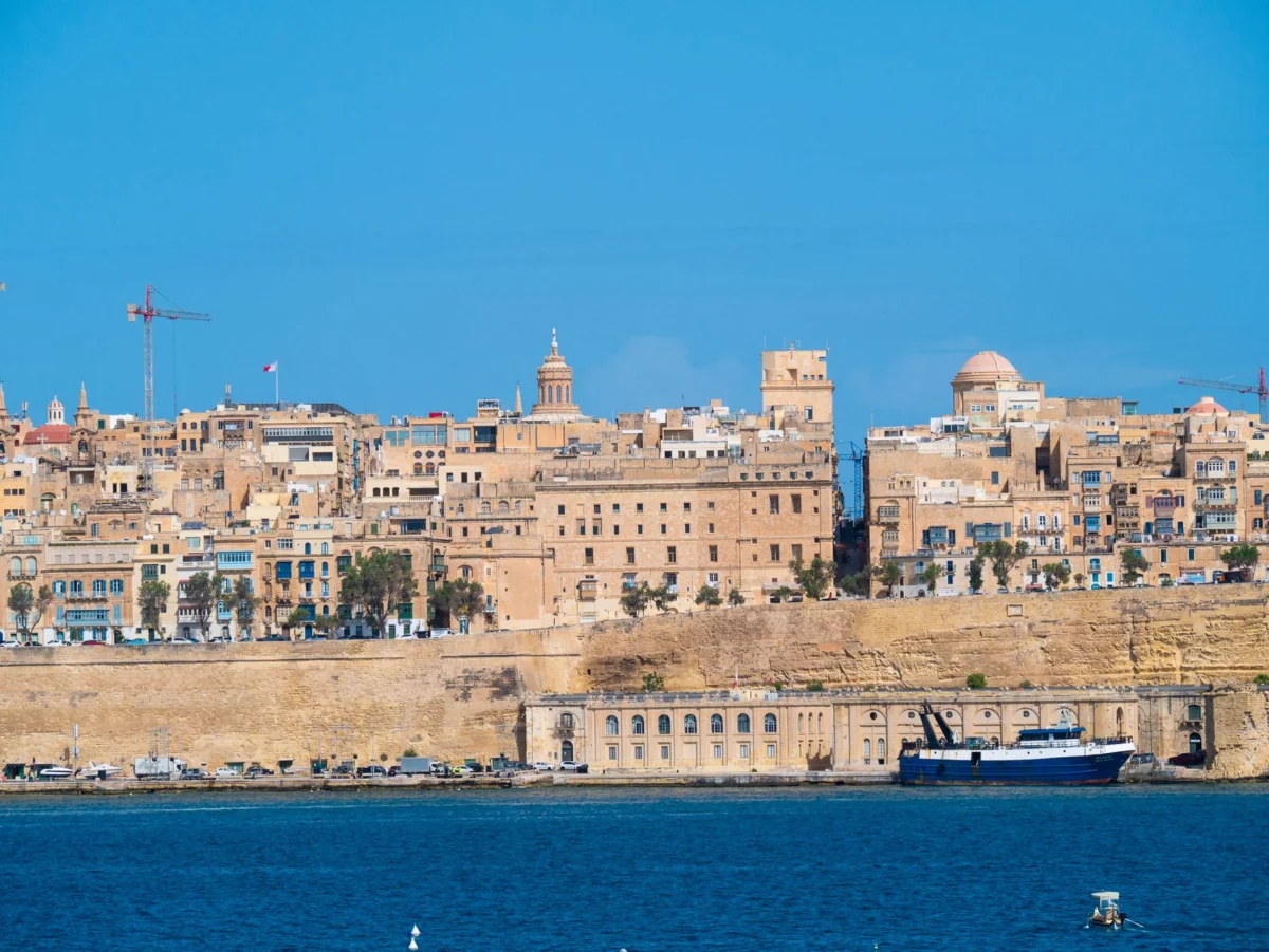 Panoramic view of Valletta's historic skyline at sunset