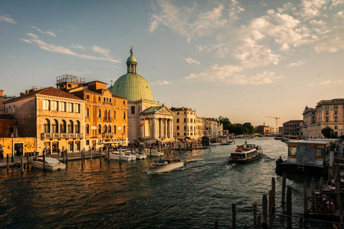 A romantic sunset over a serene Venice canal