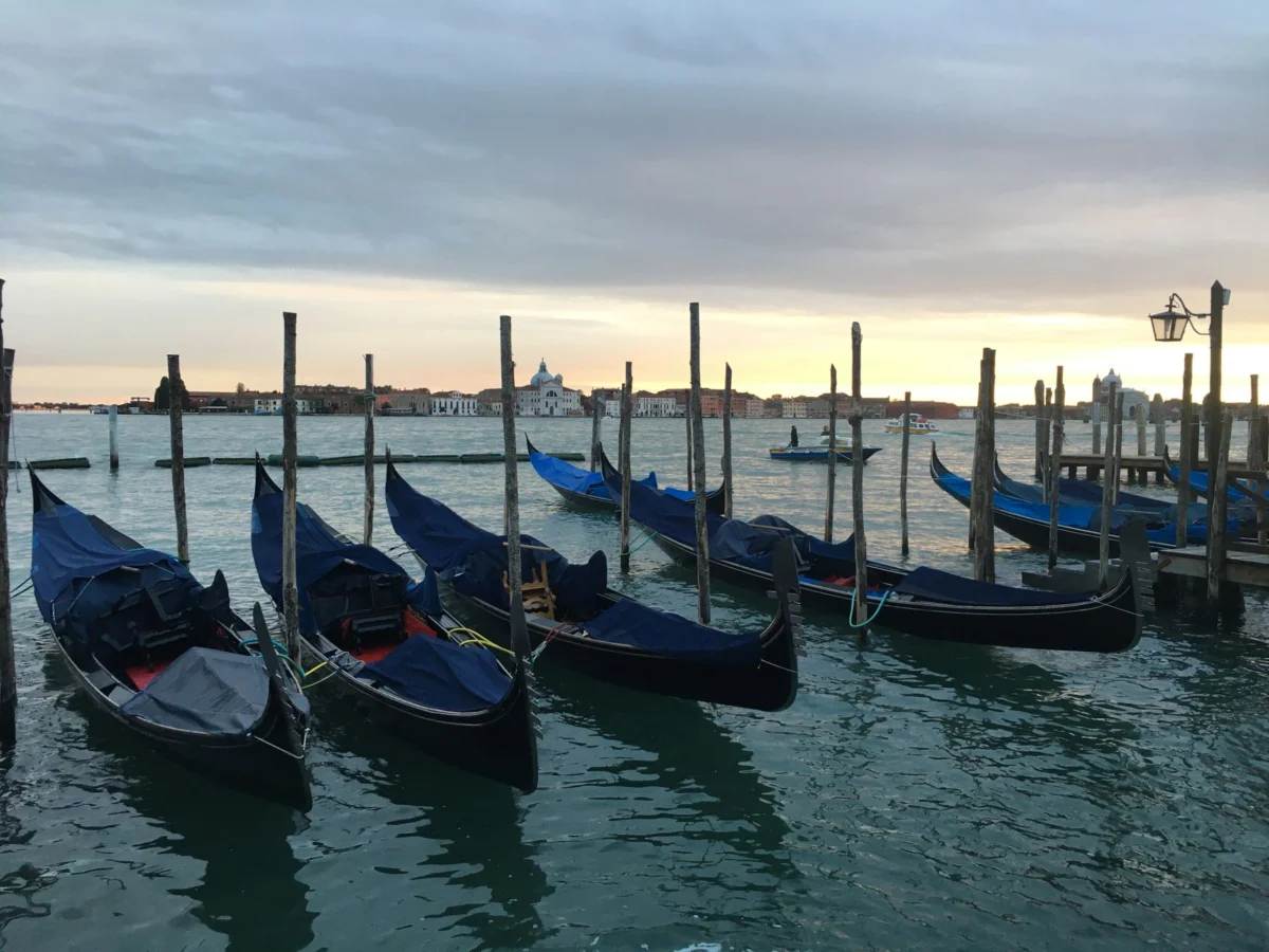 Romantic sunset gondola ride in Venice canals