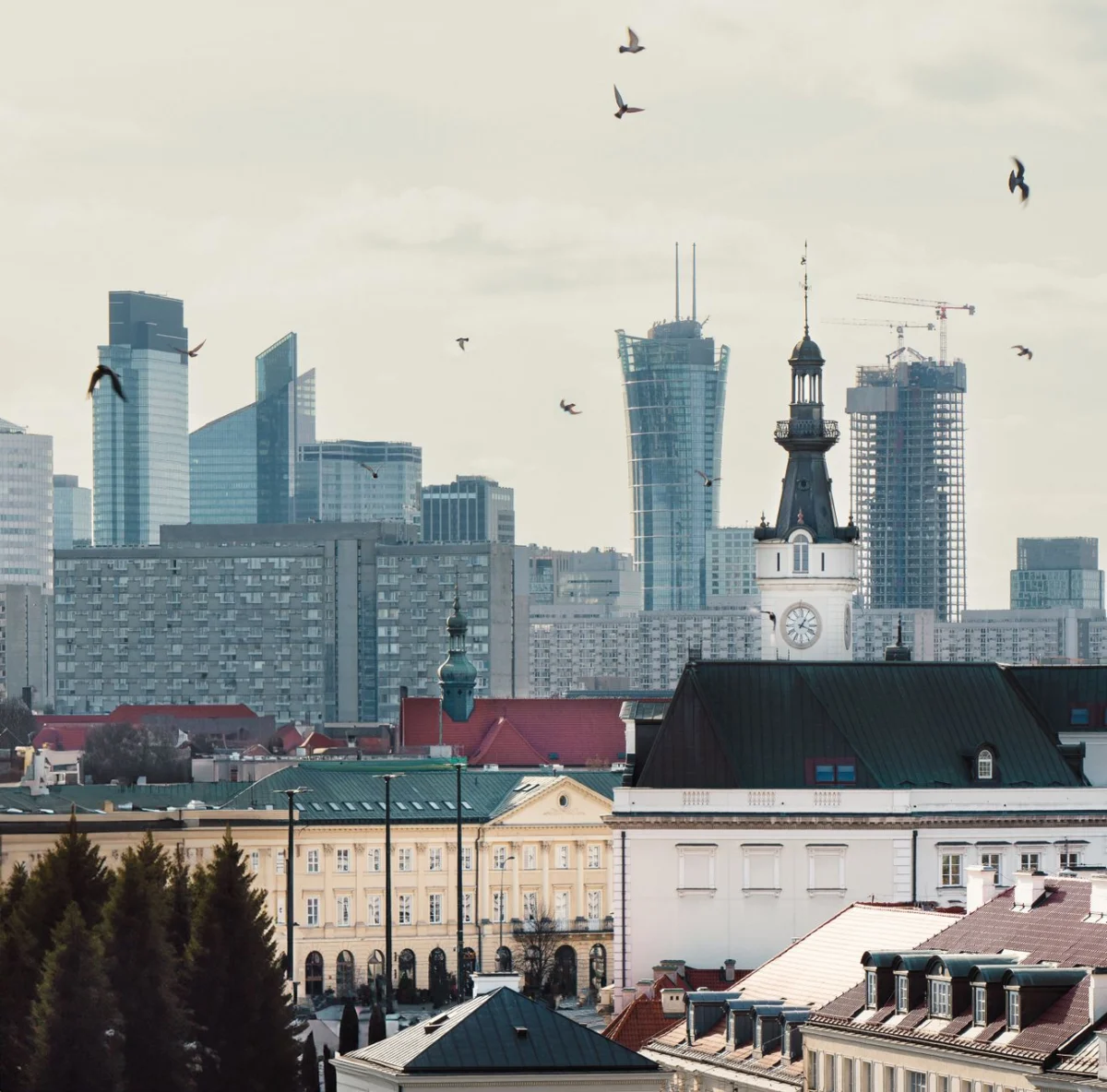 View of Warsaw’s historic buildings at sunset