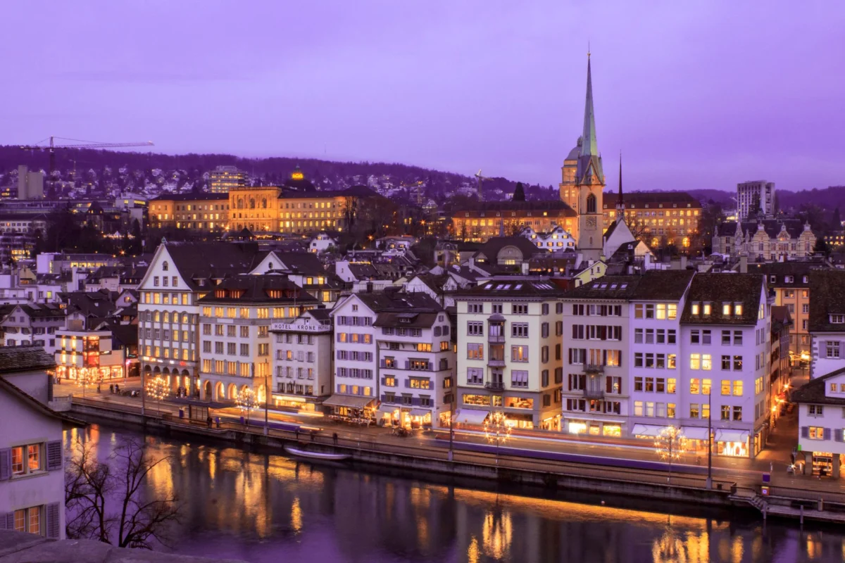 Romantic view of Zurich rooftops and river at sunset
