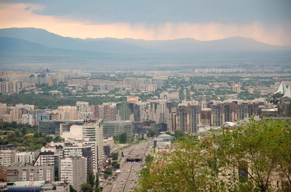 Skyline view of Almaty featuring mountains and cityscape