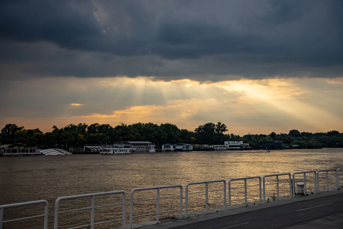 A romantic view of Antwerp's riverside at sunset