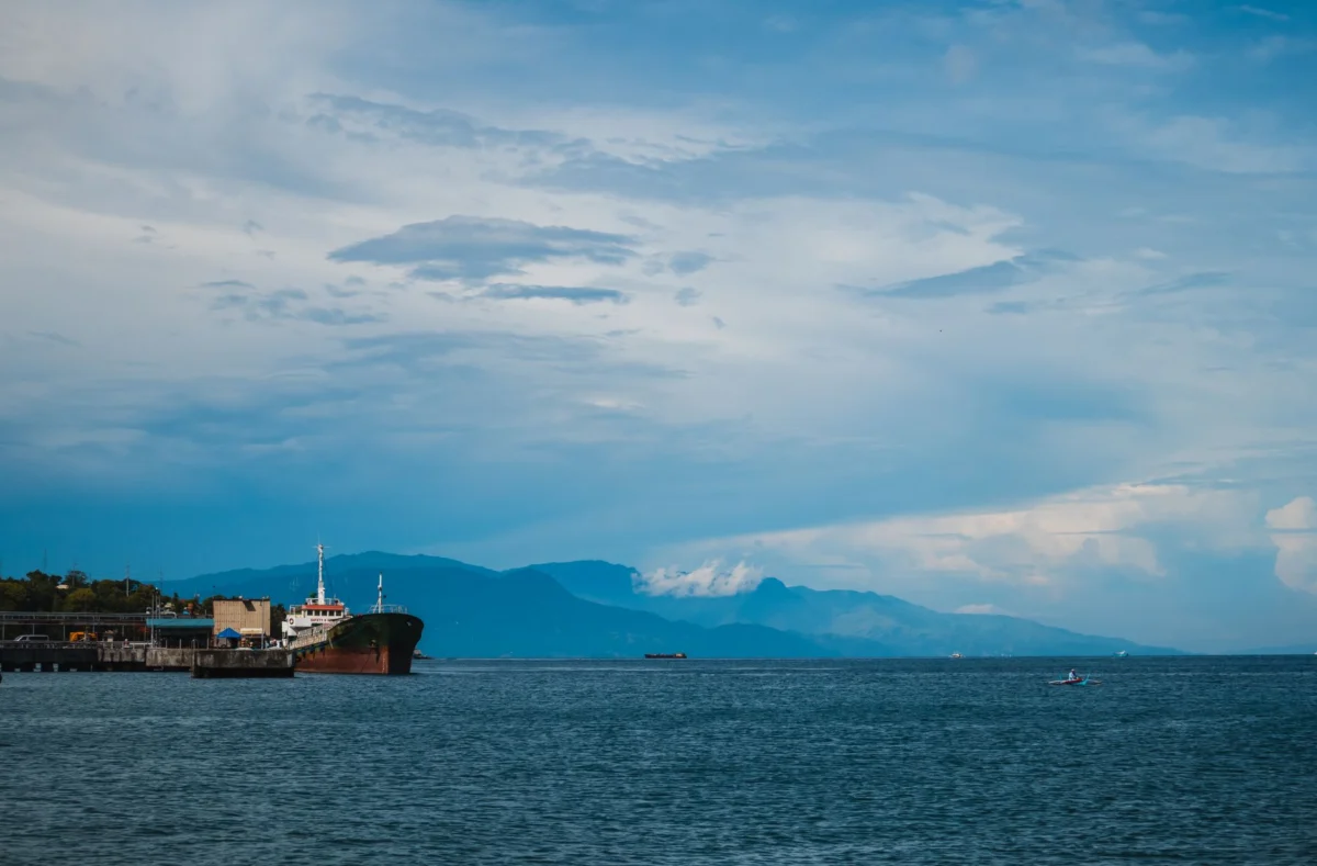 Scenic view of Apia's skyline by the harbor, showcasing key landmarks