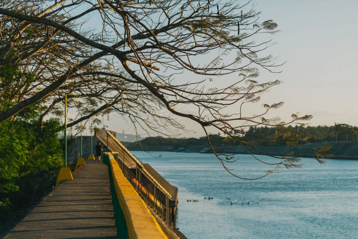 Scenic view of Bahir Dar's riverside at sunset with cultural landmarks