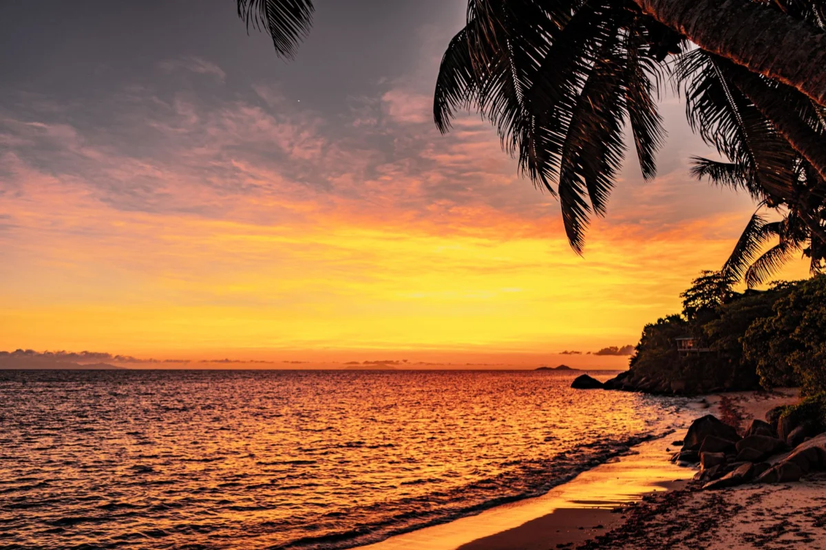 Sunset over the beach in Beau Vallon, showcasing budget-friendly serenity