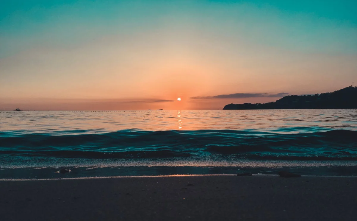 Romantic sunset over Bequia's tranquil beach landscape