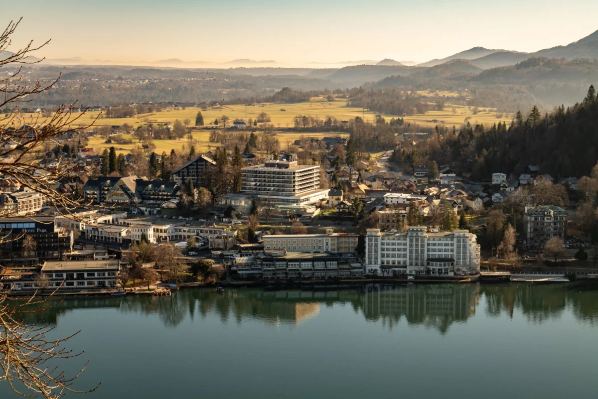 Scenic view of a luxury hotel by Lake Bled, Slovenia with alps
