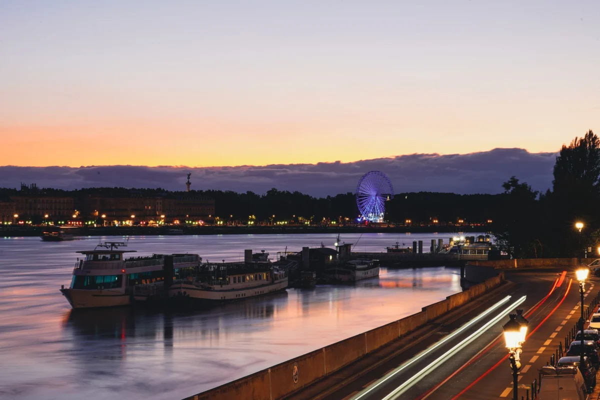 Vibrant nightlife scene in Bordeaux with city lights