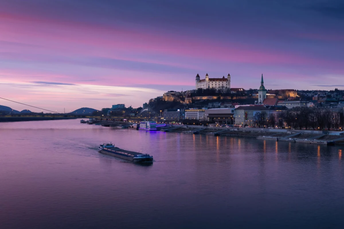 View of Bratislava castle at sunset with a city skyline