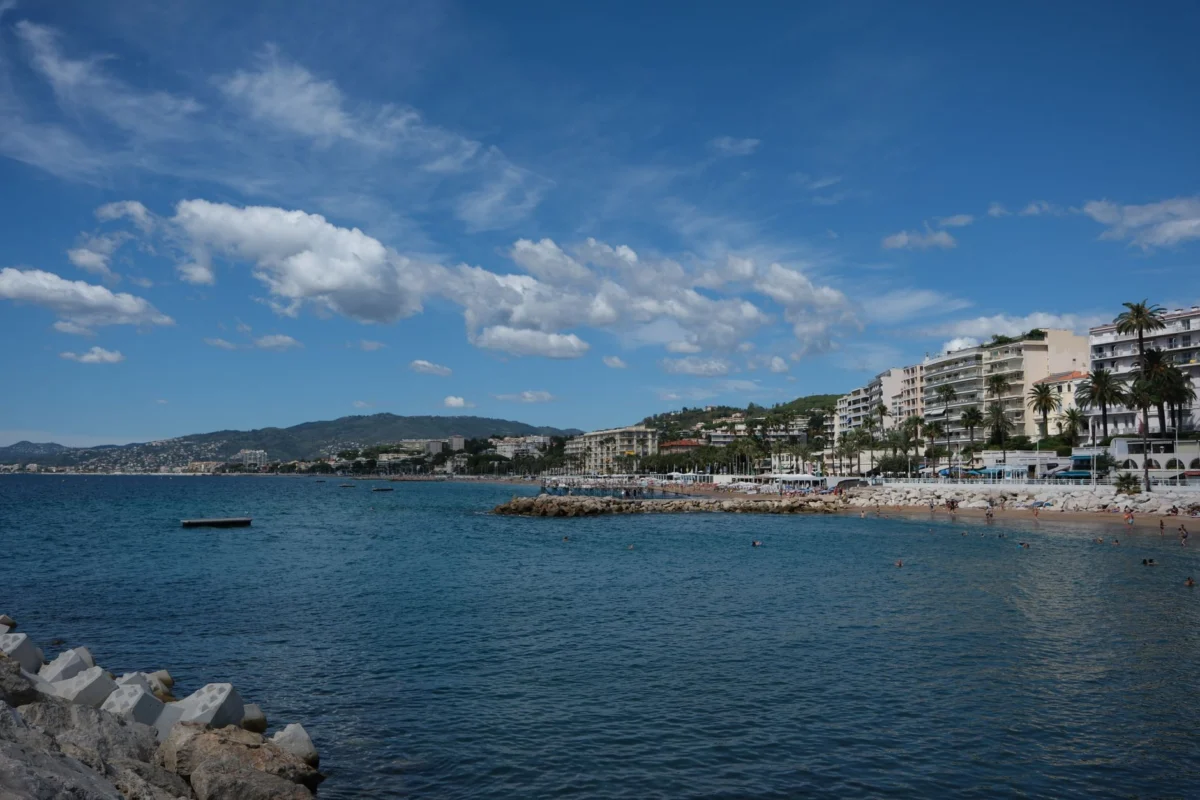 A scenic view of Cannes coastline with iconic landmarks