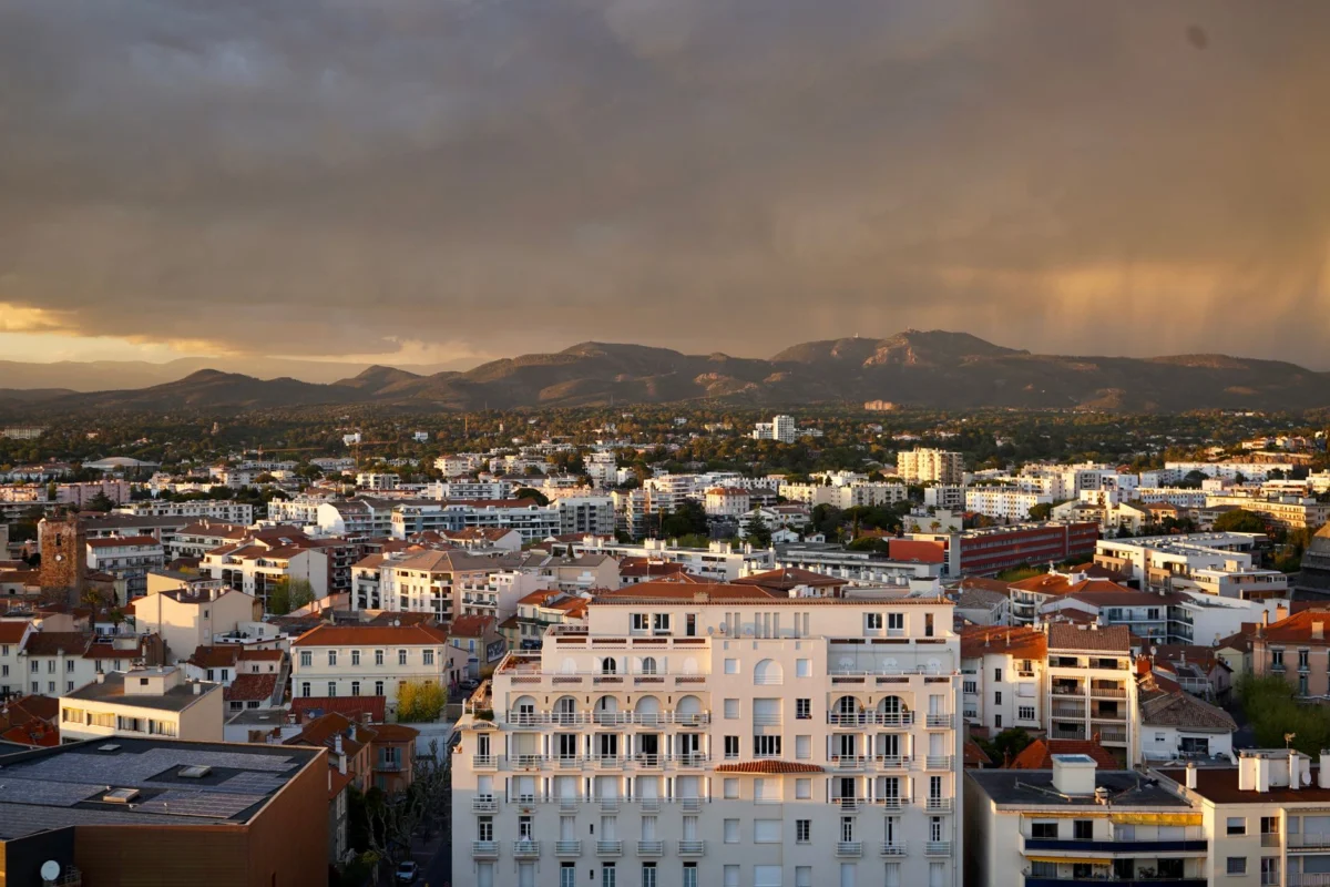 Romantic evening view of Cannes cityscape at sunset
