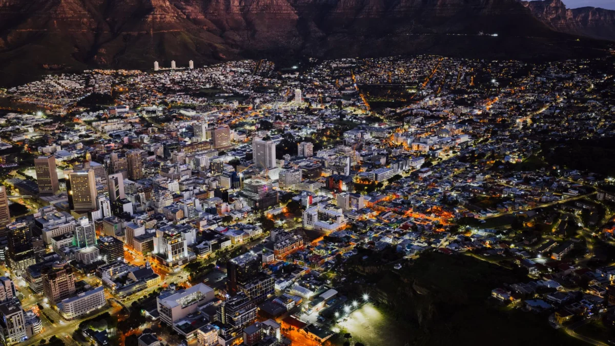 Cape Town skyline lit up at night with Table Mountain