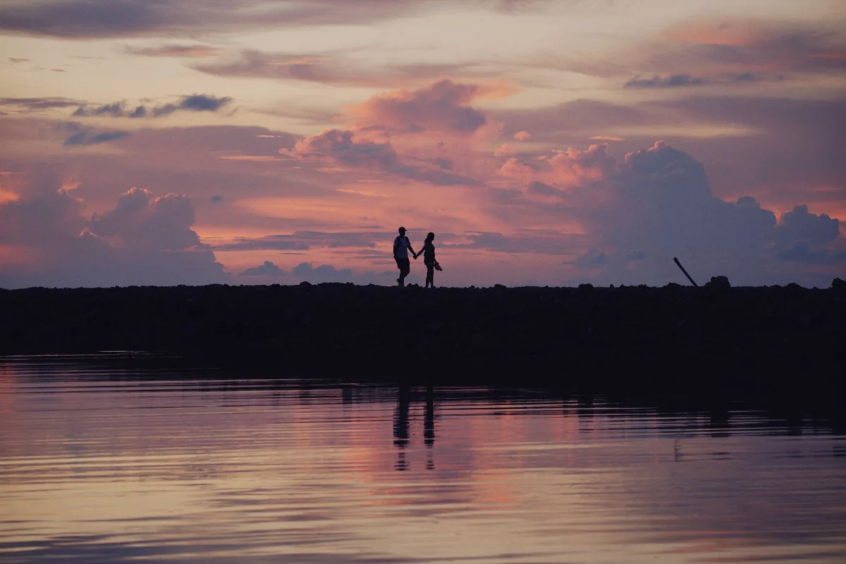 Couple enjoying a romantic sunset in Caye Caulker