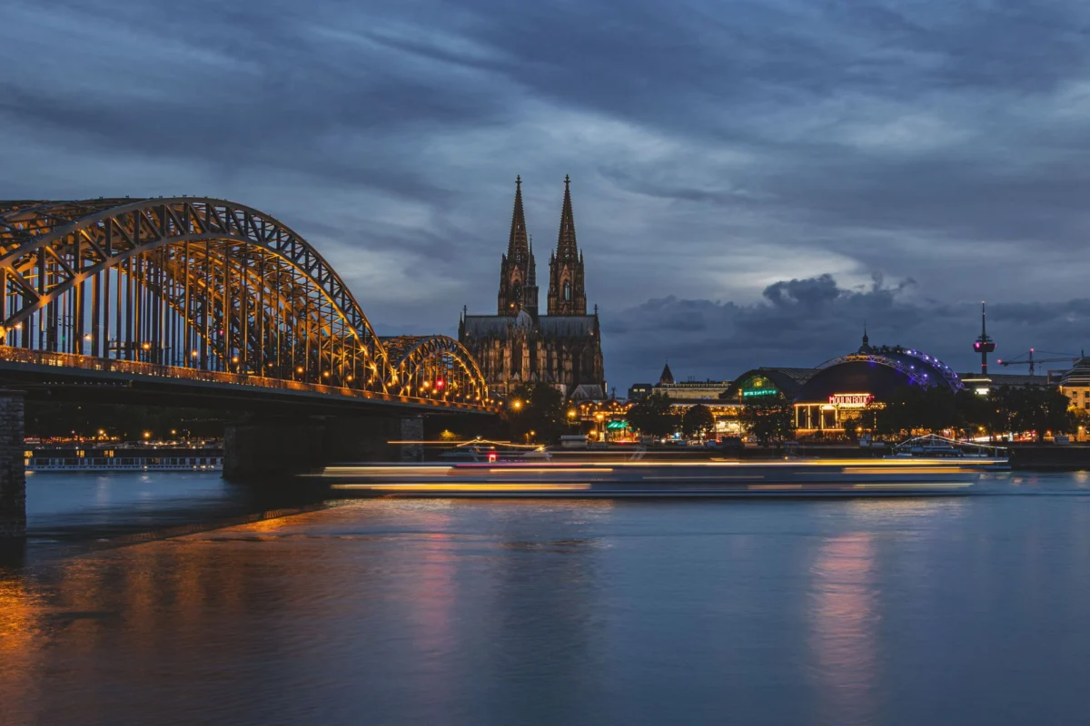 Romantic evening view of Cologne Cathedral and Rhine River