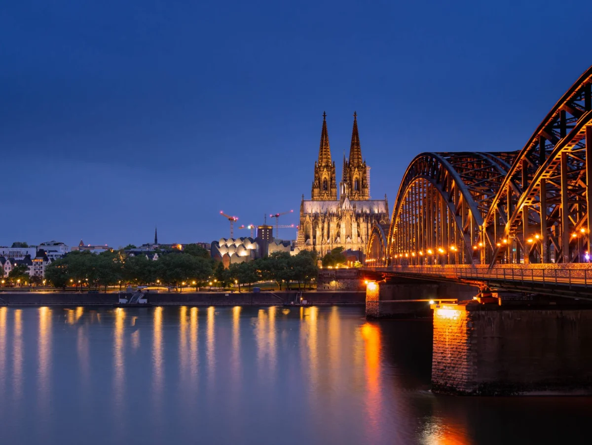 A stunning view of the Cologne Cathedral under a clear blue sky