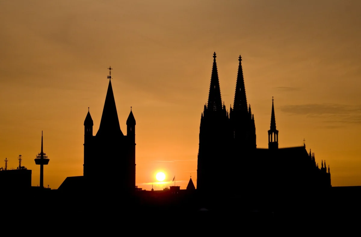 Romantic view of Cologne skyline with cathedral at sunset
