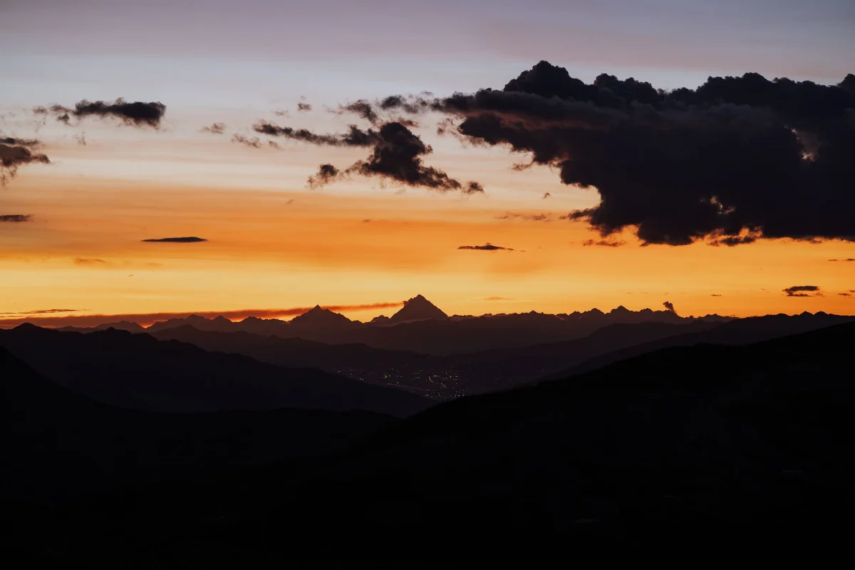 Romantic sunset over Cusco cityscape