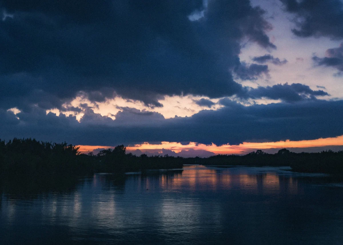 Romantic view of Roseau at dusk with riverside scenery