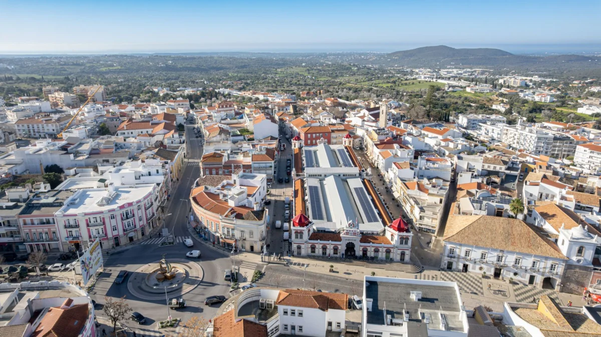 Aerial view of Faro's historic skyline at sunset