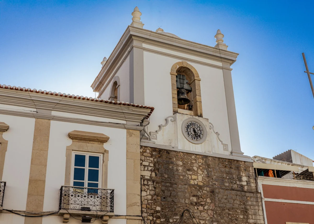 View of Faro's skyline at sunset with historical landmarks