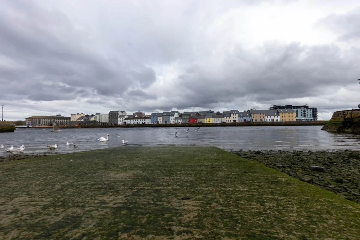 Scenic view of Galway city by the river with historical landmarks