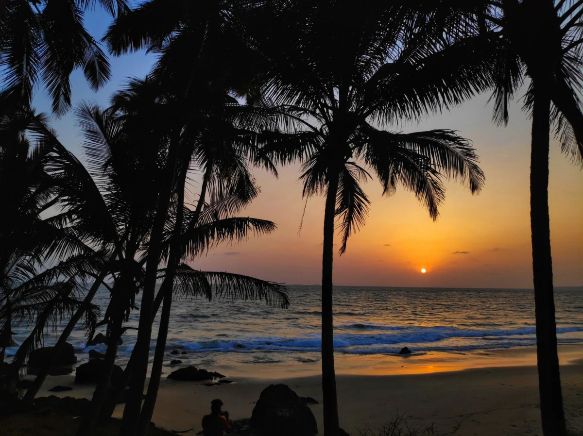 A scenic sunset view from a rooftop in Goa, capturing the romantic ambiance