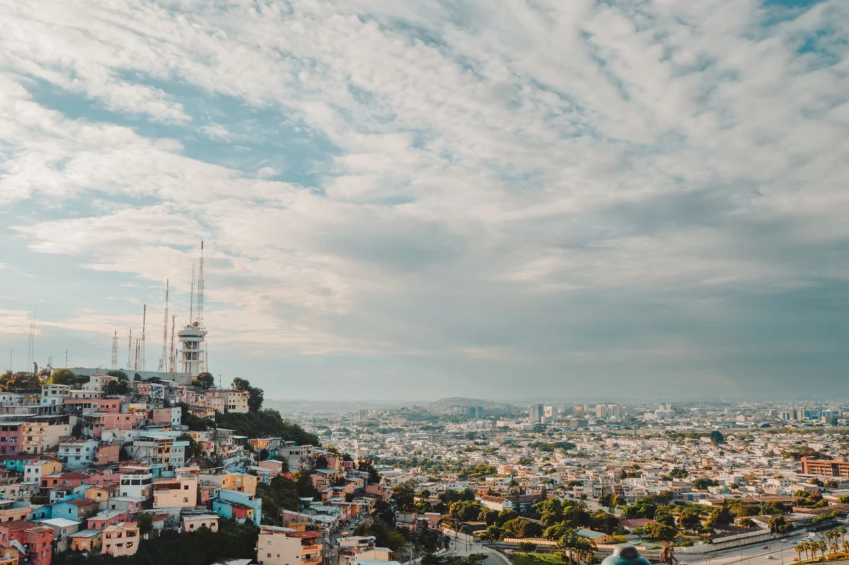 Romantic sunset view of Guayaquil's skyline over the river